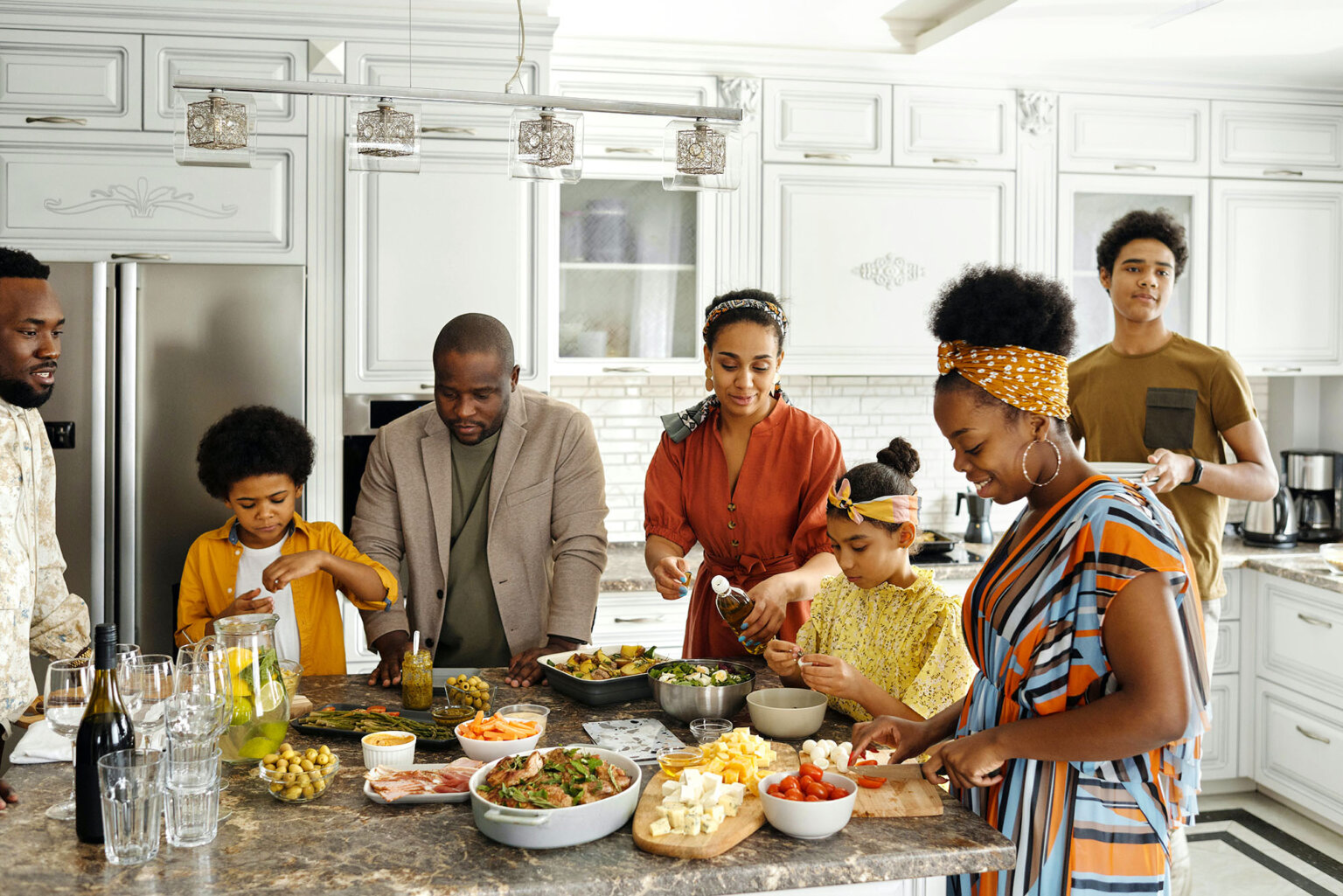 family gathered around the kitchen for dinner