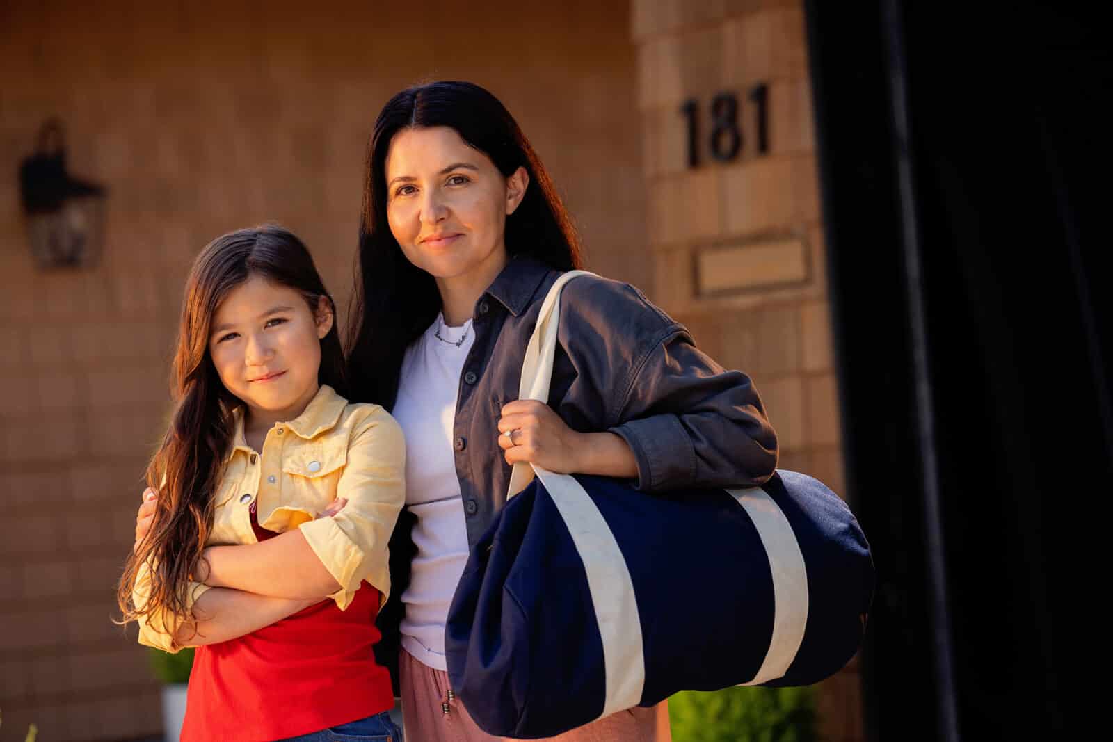 Mother and daughter with Go Bag, ready for evacuation.