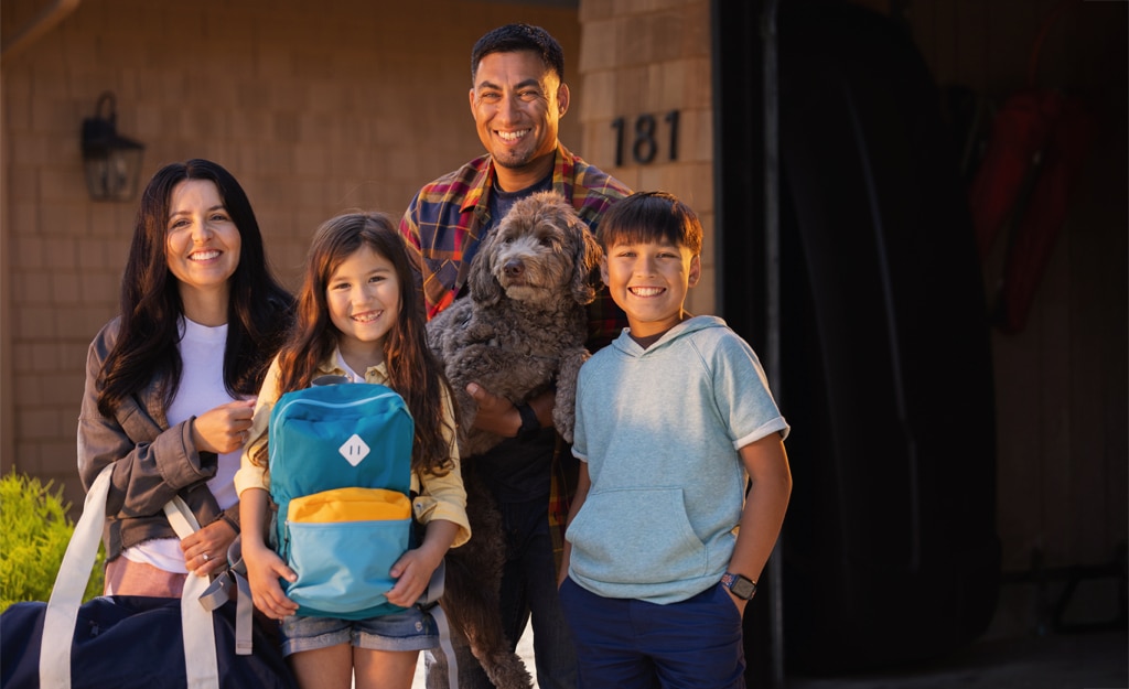 family smiling with go bag