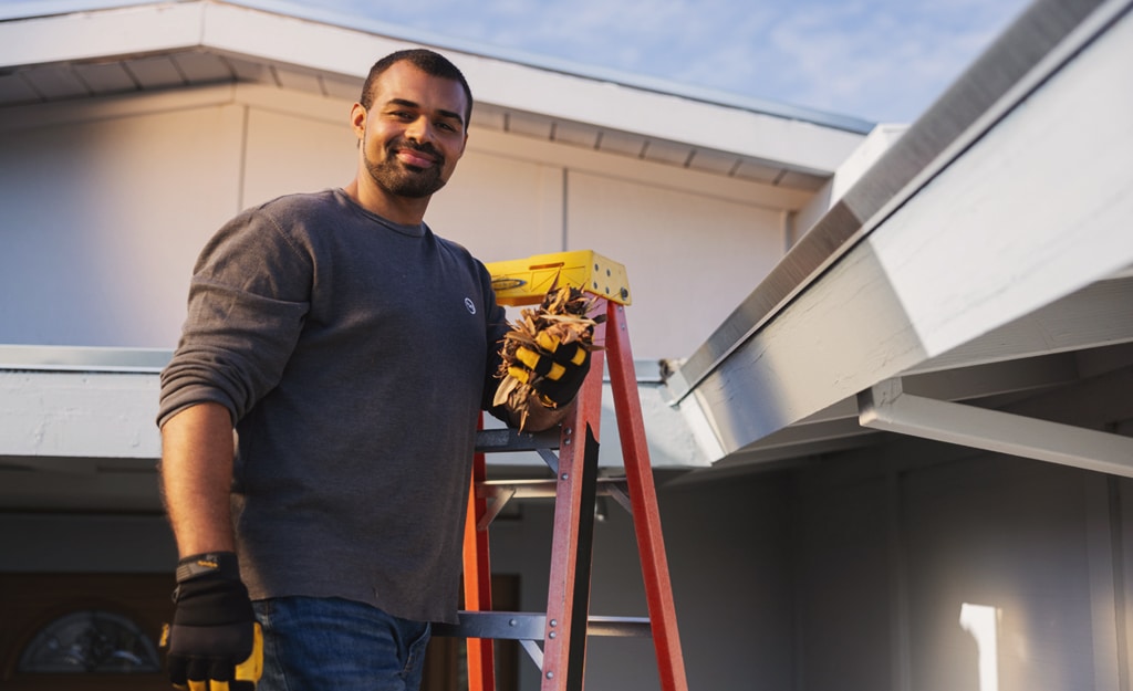 man on ladder at home